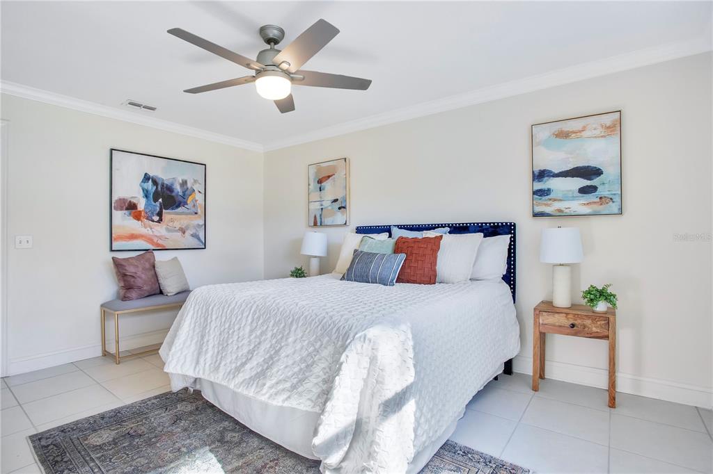 619 Marphil Loop Brandon, FL 33511 - Photo 21 of 36 a bedroom with a bed and a painting on the wall