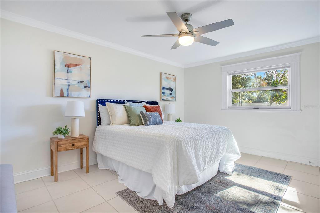 619 Marphil Loop Brandon, FL 33511 - Photo 22 of 36 a bedroom with a bed and a chandelier