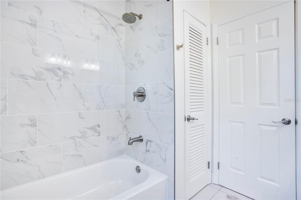 619 Marphil Loop Brandon, FL 33511 - Photo 24 of 36 a bathroom with a bathtub and shower