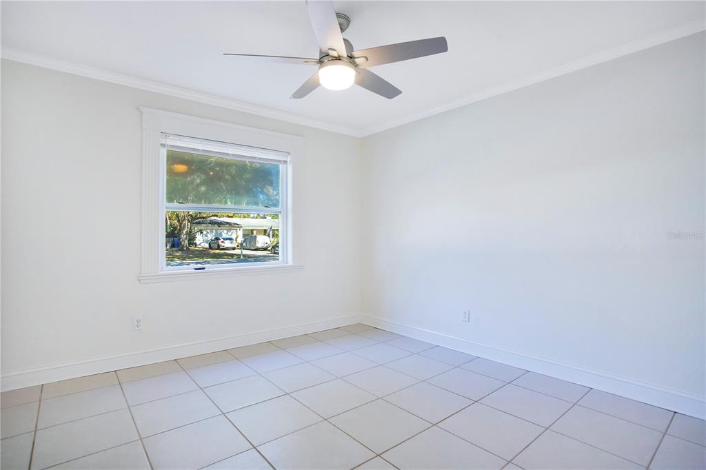 619 Marphil Loop Brandon, FL 33511 - Photo 28 of 36 an empty room with a window and a fan