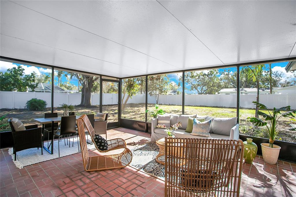 619 Marphil Loop Brandon, FL 33511 - Photo 7 of 36 a living room with furniture and a floor to ceiling window