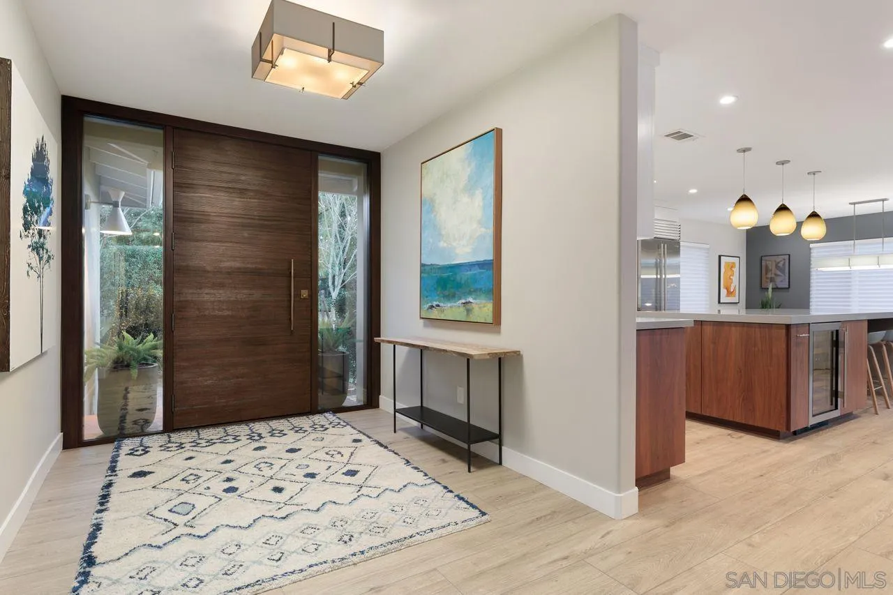 751 Hoska Drive Del Mar, CA 92014 - Photo 12 of 43 a bedroom with a bed and a dresser