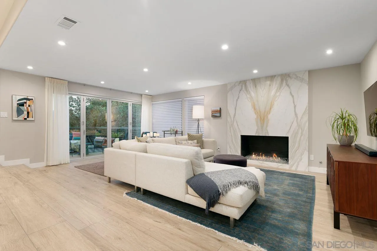 751 Hoska Drive Del Mar, CA 92014 - Photo 13 of 43 a living room with furniture fireplace and window