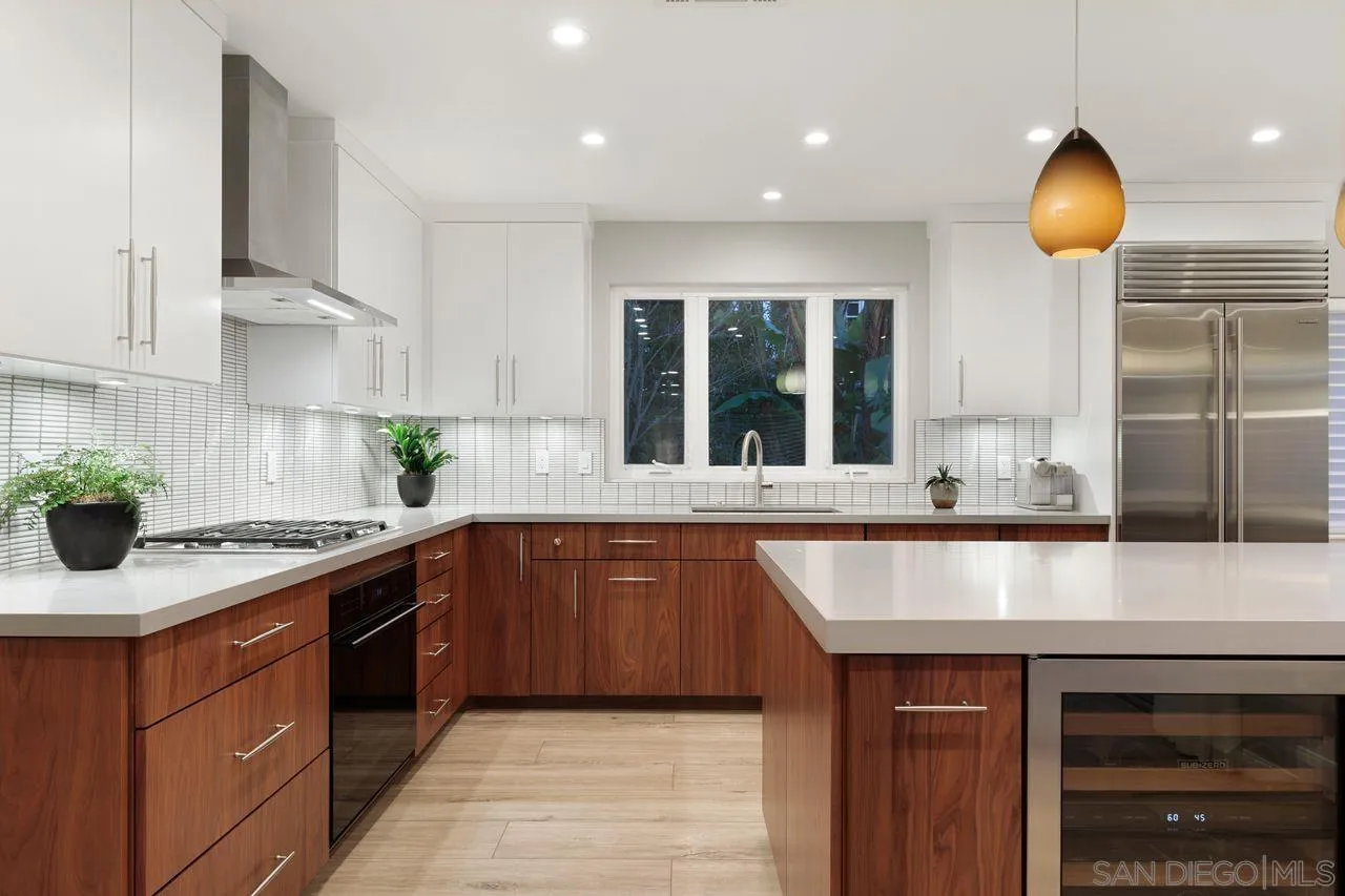 751 Hoska Drive Del Mar, CA 92014 - Photo 17 of 43 a kitchen with kitchen island granite countertop a sink and a stove