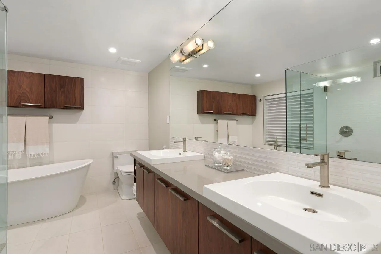 751 Hoska Drive Del Mar, CA 92014 - Photo 34 of 43 a bathroom with a double vanity sink a mirror and bathtub
