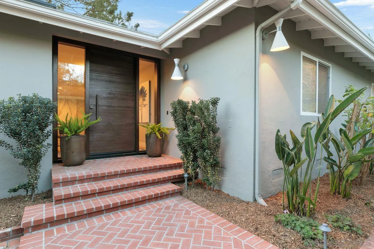 751 Hoska Drive Del Mar, CA 92014 - Photo 10 of 43 a house with potted plants in front of door