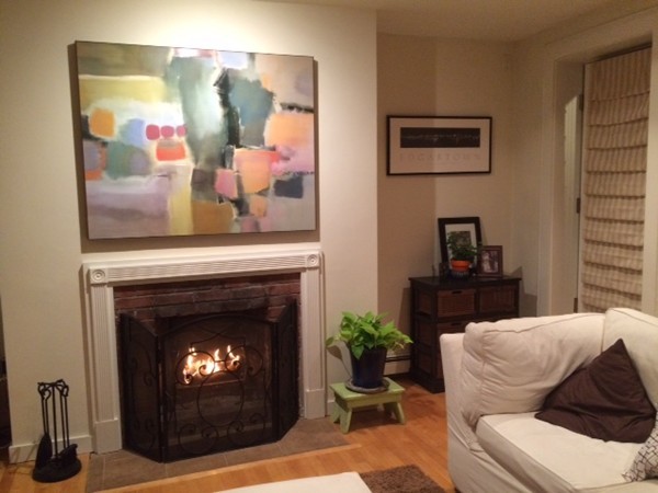 315-317 Beacon Street, Unit 1 Boston, MA 02116 - Photo 3 of 11 a living room with furniture and a fireplace