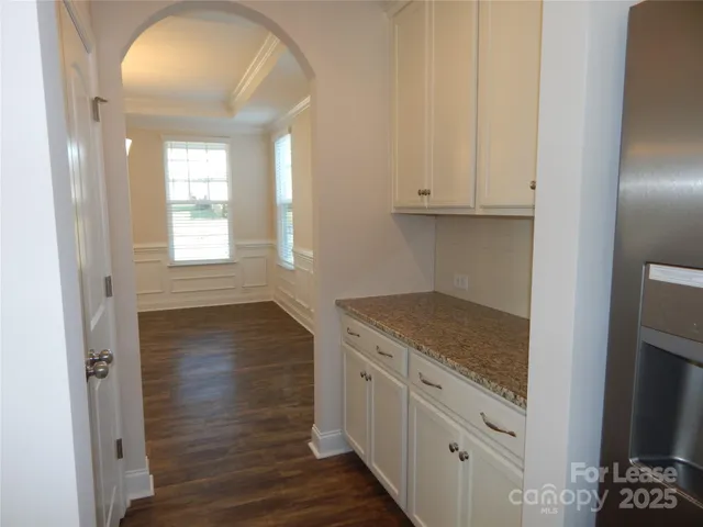 a kitchen with granite countertop white cabinets and a granite counter tops