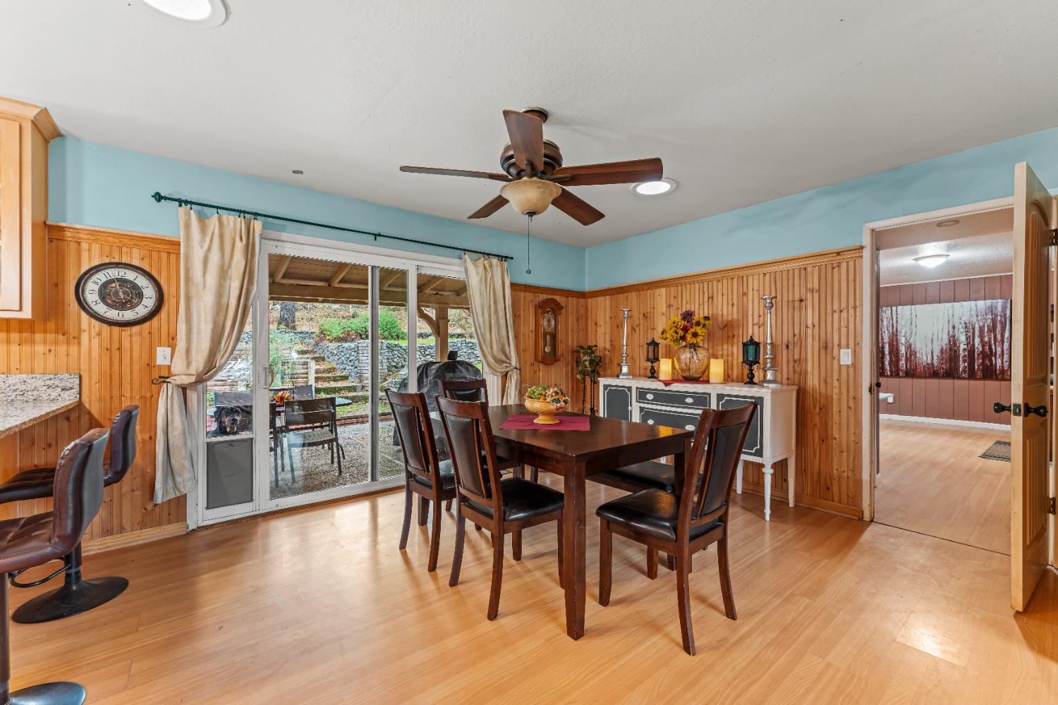 12987 Hidden Valley Road Grass Valley, CA 95949 - Photo 12 of 36 a view of a dining room with furniture window and wooden floor