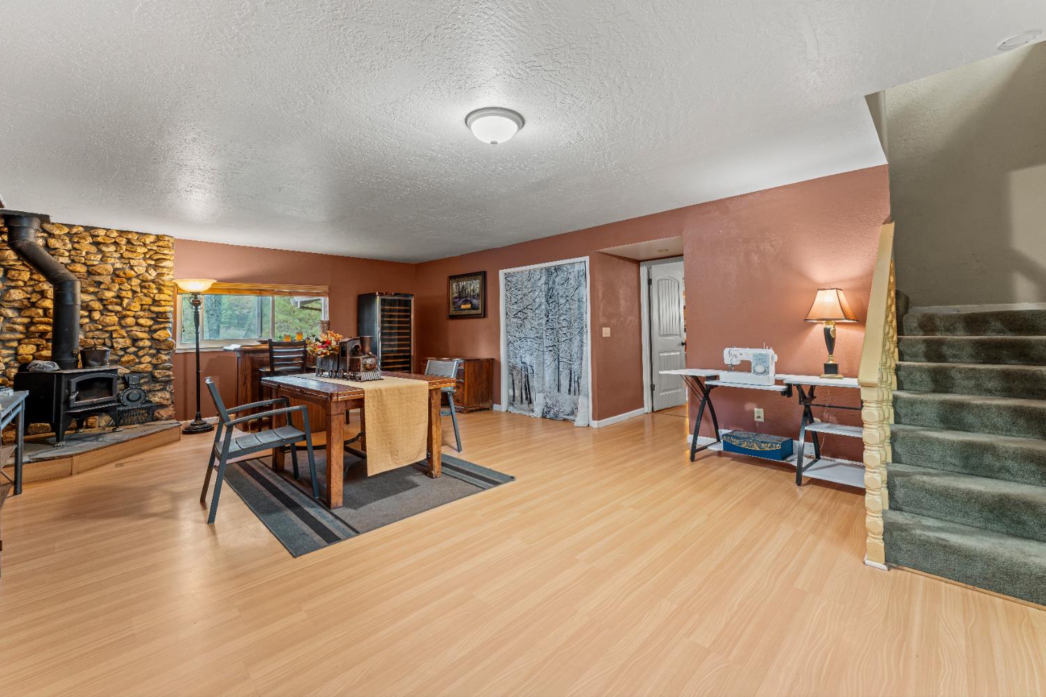 12987 Hidden Valley Road Grass Valley, CA 95949 - Photo 13 of 36 a living room with furniture and a wooden floor