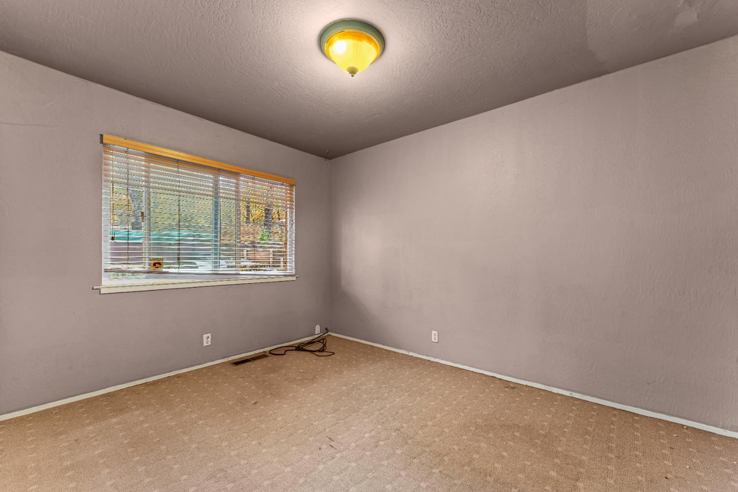 12987 Hidden Valley Road Grass Valley, CA 95949 - Photo 16 of 36 an empty room with a window