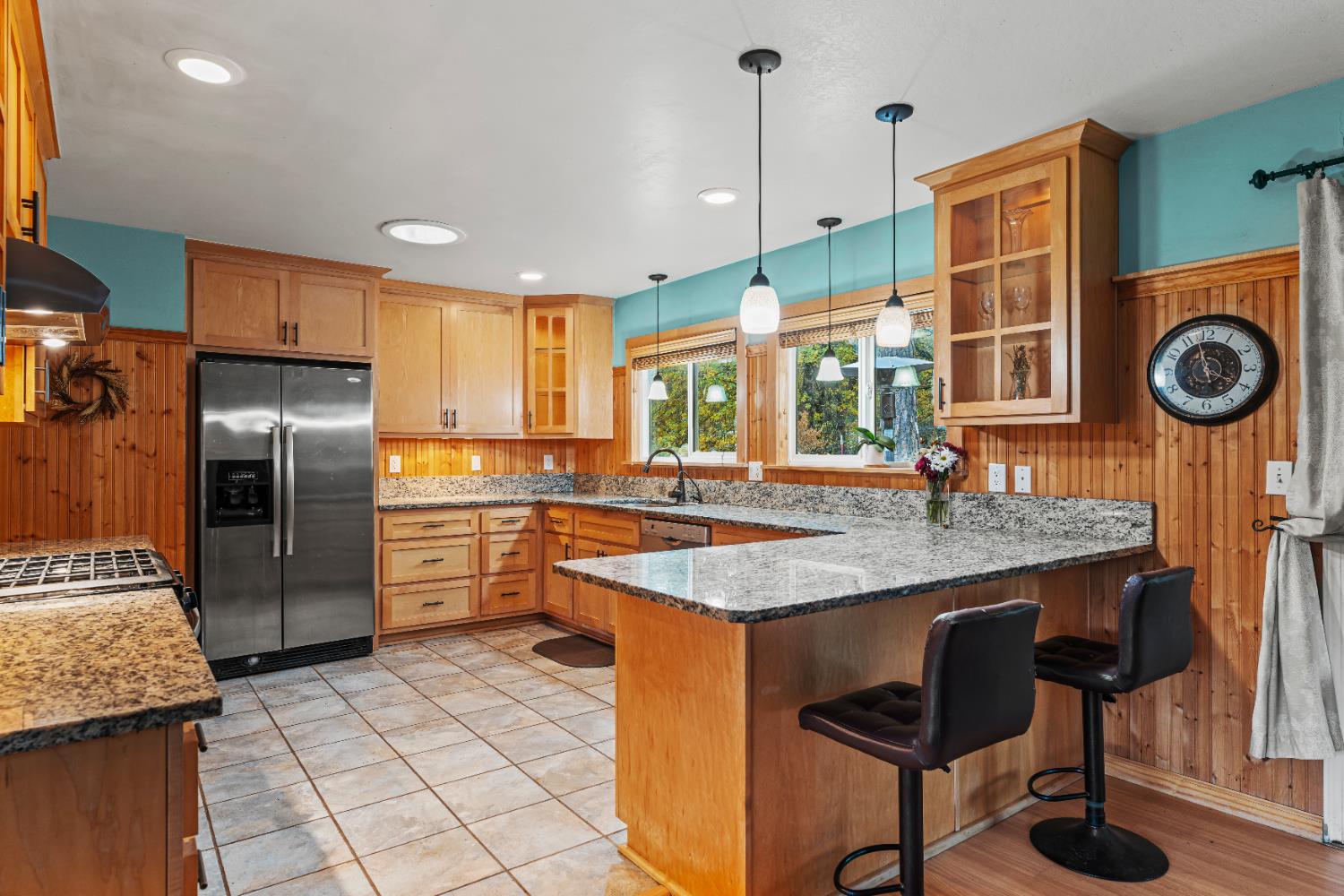 12987 Hidden Valley Road Grass Valley, CA 95949 - Photo 8 of 36 a kitchen with stainless steel appliances granite countertop a sink a stove and a refrigerator