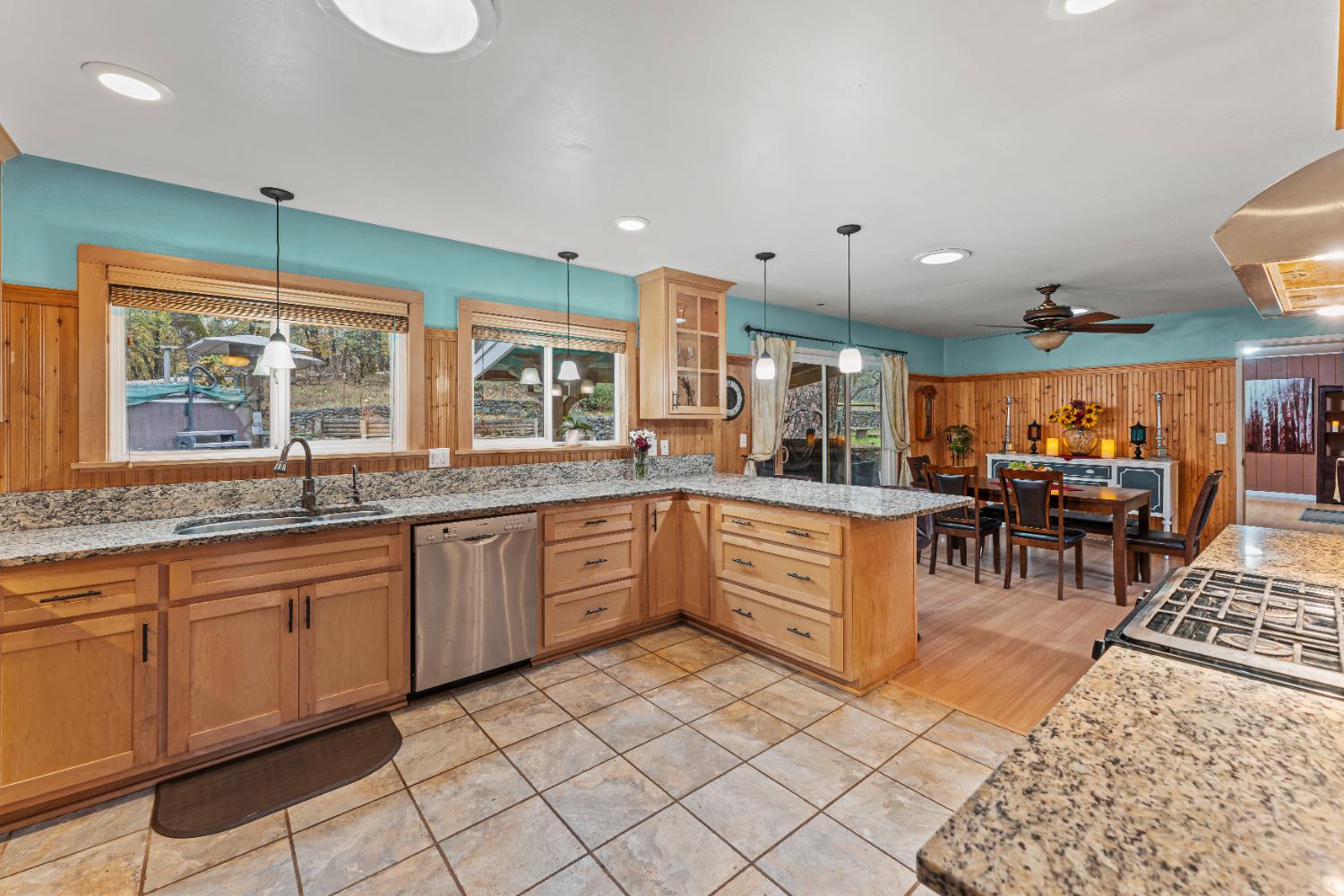 12987 Hidden Valley Road Grass Valley, CA 95949 - Photo 10 of 36 a kitchen with stainless steel appliances granite countertop a stove a sink and a refrigerator