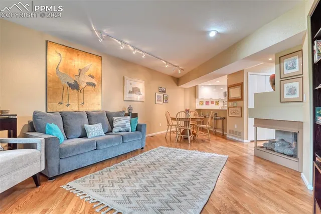 a bathroom with a granite countertop toilet sink and mirror
