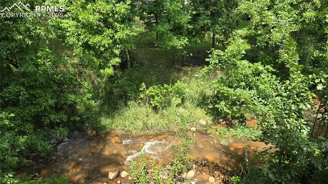 a kitchen with stainless steel appliances granite countertop a stove and a sink