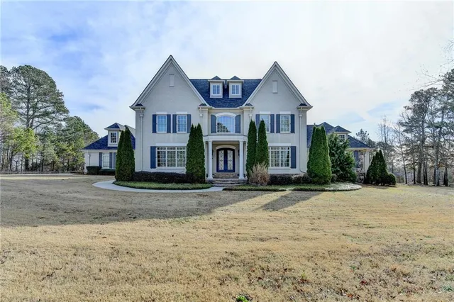 a front view of a house with garden