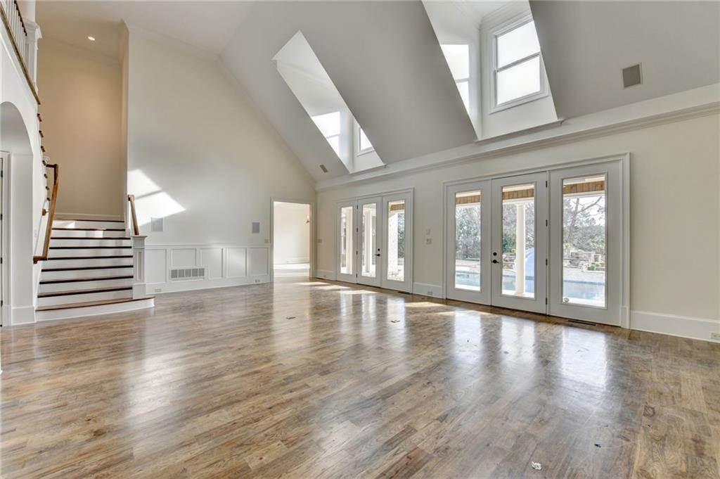 4045 Ridge Road Buford, GA 30519 - Photo 12 of 97 wooden floor in an empty room with a window