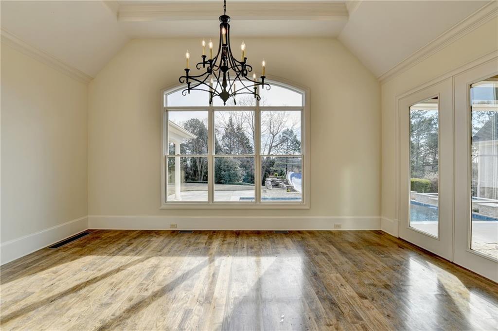 4045 Ridge Road Buford, GA 30519 - Photo 18 of 97 a view of a room with wooden floor chandelier and windows