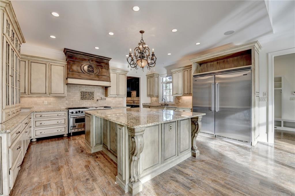 4045 Ridge Road Buford, GA 30519 - Photo 20 of 97 a kitchen with stainless steel appliances granite countertop a stove oven and a refrigerator