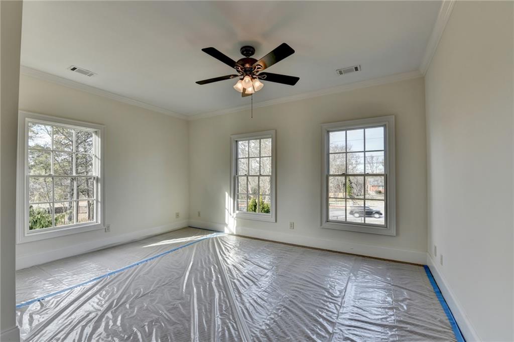 4045 Ridge Road Buford, GA 30519 - Photo 53 of 97 a view of an empty room with a window and wooden floor