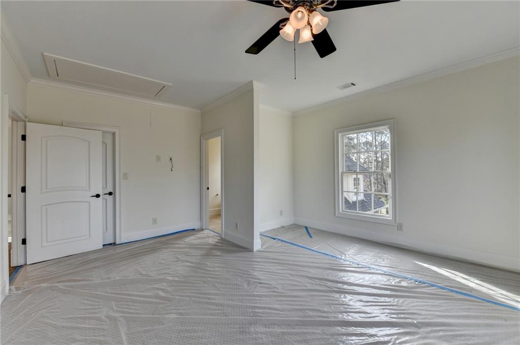 4045 Ridge Road Buford, GA 30519 - Photo 55 of 97 a view of an empty room with a window and wooden floor