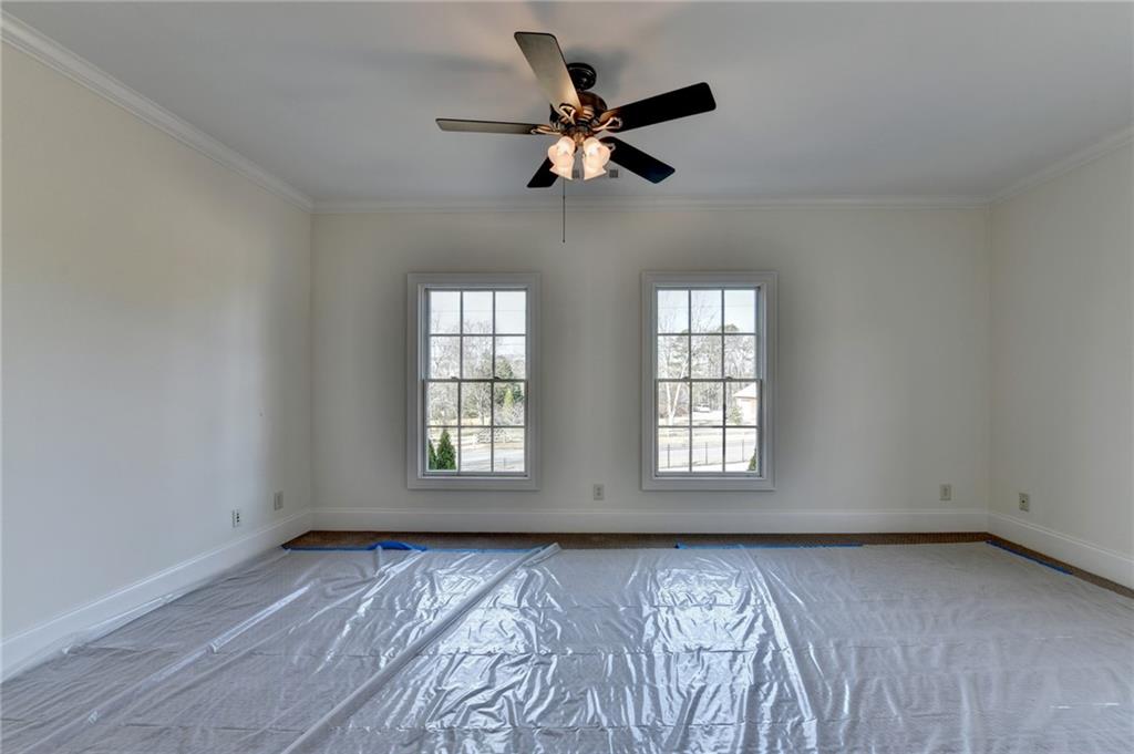 4045 Ridge Road Buford, GA 30519 - Photo 62 of 97 an empty room with wooden floor and windows