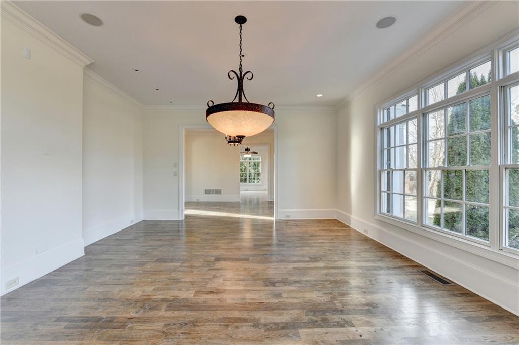 4045 Ridge Road Buford, GA 30519 - Photo 7 of 97 a view of an empty room with window and wooden floor