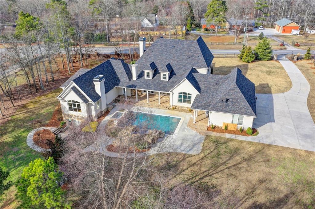 4045 Ridge Road Buford, GA 30519 - Photo 93 of 97 an aerial view of a house with a yard basket ball court and outdoor seating
