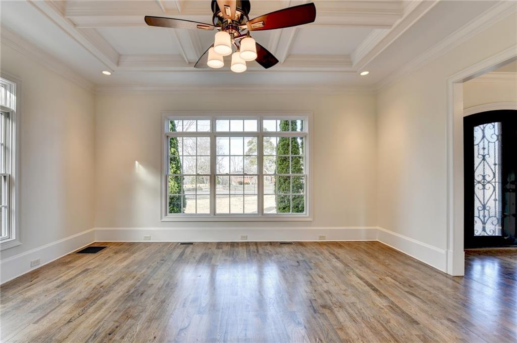 4045 Ridge Road Buford, GA 30519 - Photo 10 of 97 a view of an empty room with wooden floor and a window