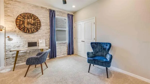 a living room with furniture and a chair