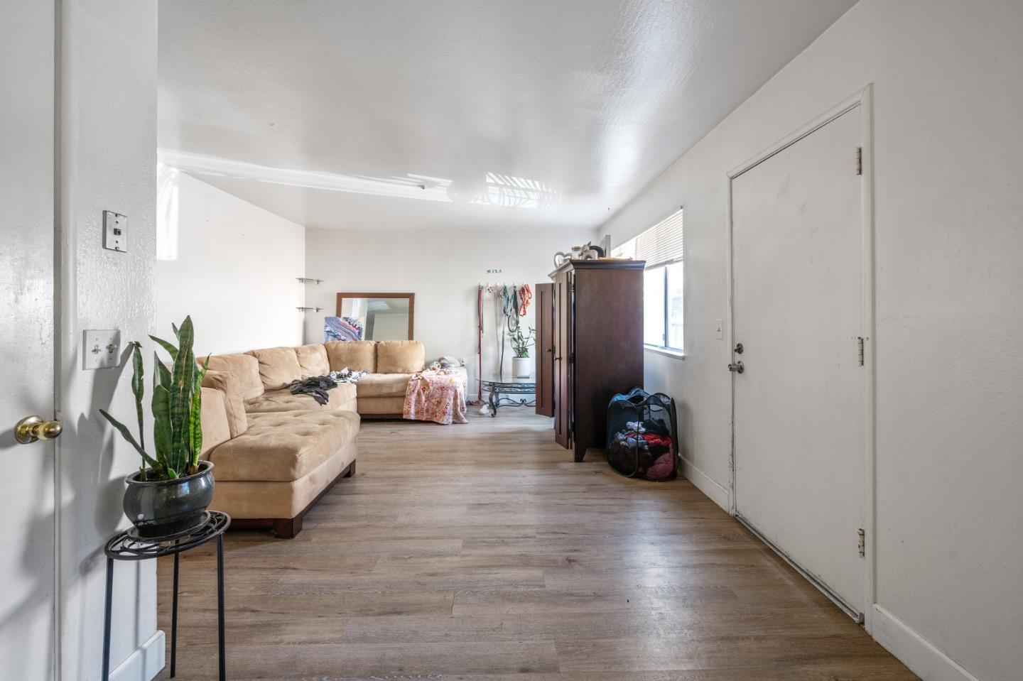752 Beaver Street Santa Rosa, CA 95404 - Photo 5 of 9 a living room with furniture and a chandelier