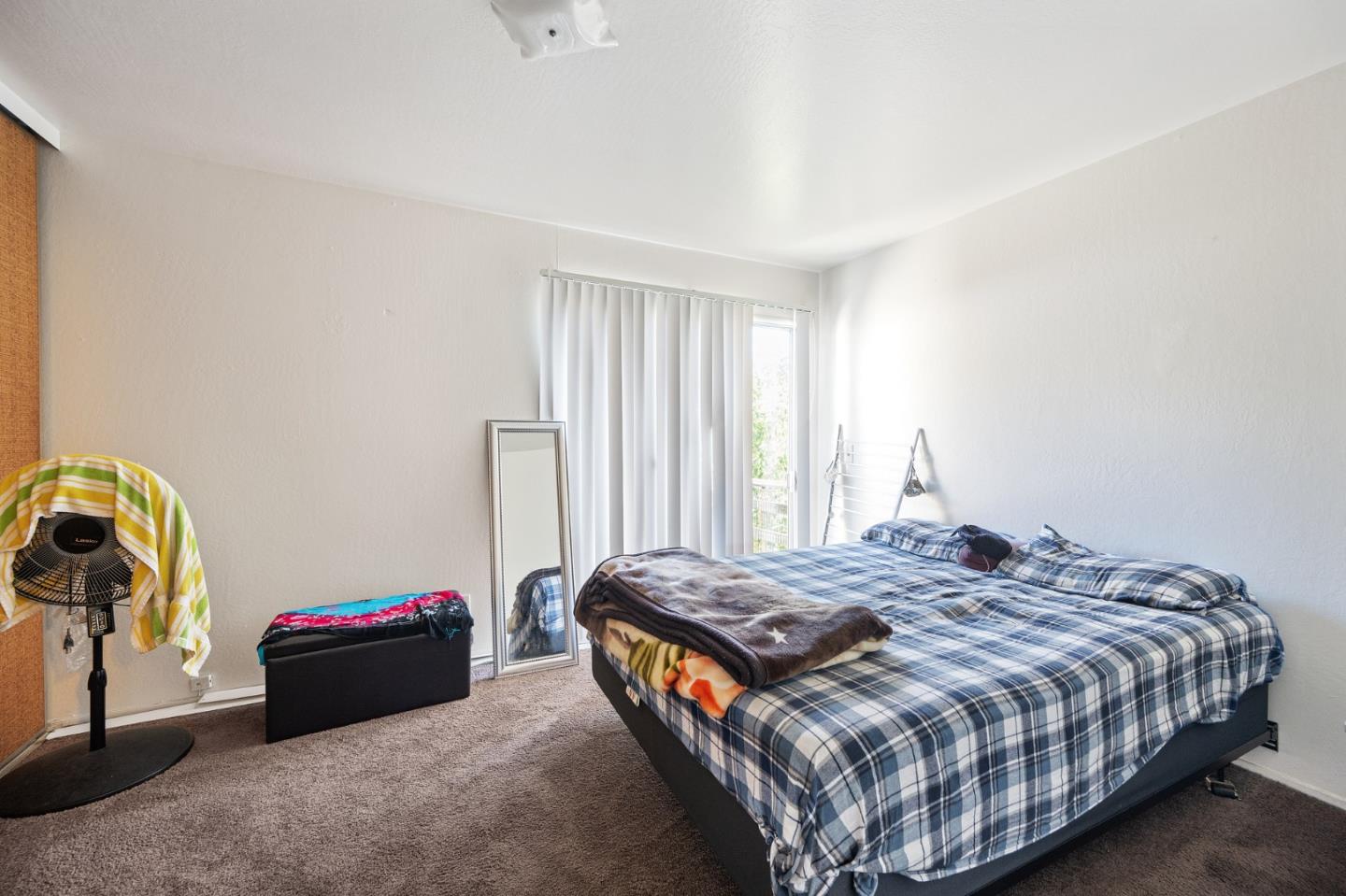 752 Beaver Street Santa Rosa, CA 95404 - Photo 7 of 9 a bedroom with a bed and a window