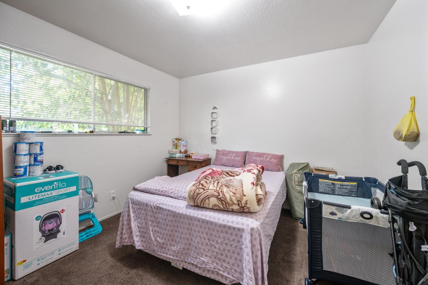 752 Beaver Street Santa Rosa, CA 95404 - Photo 8 of 9 a bedroom with a bed and a window