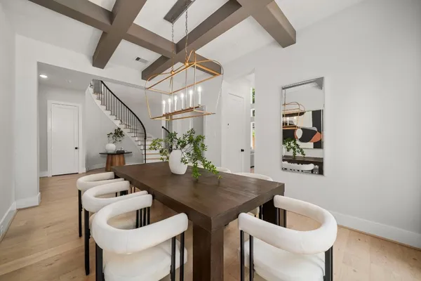 a living room with furniture a large window and a sink