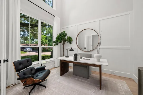 a bathroom with a granite countertop sink a toilet and a mirror
