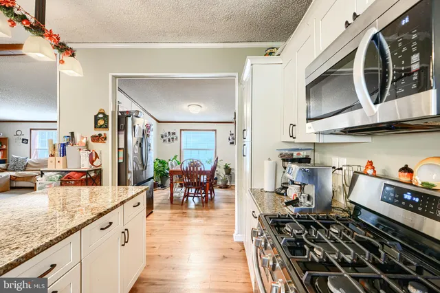 a kitchen with lots of counter top space and dining table