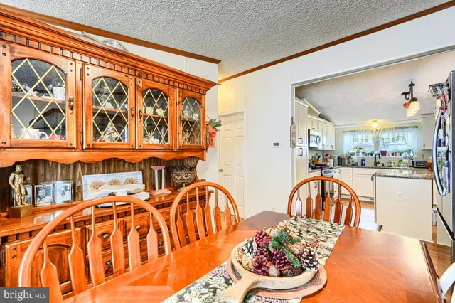 a view of a patio with a dining table and chairs