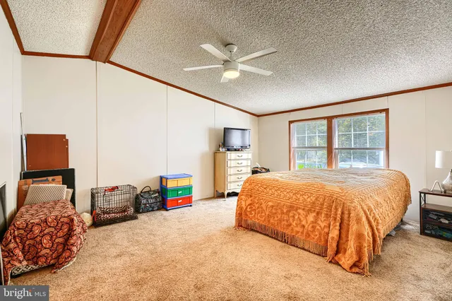 a bedroom with a bed and a large cabinets