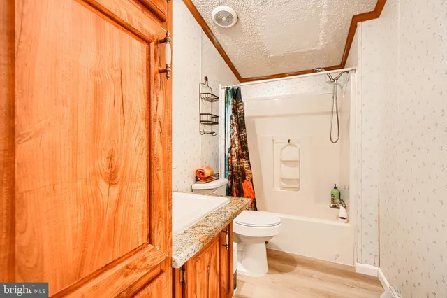 a bathroom with a toilet a sink and a bathtub