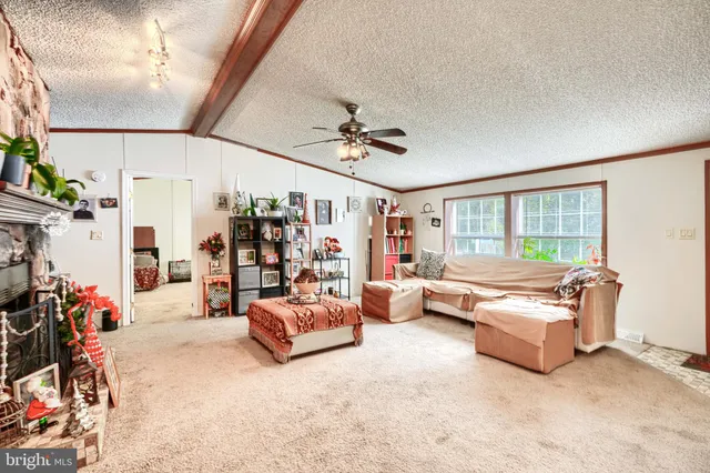 a living room with furniture and white walls