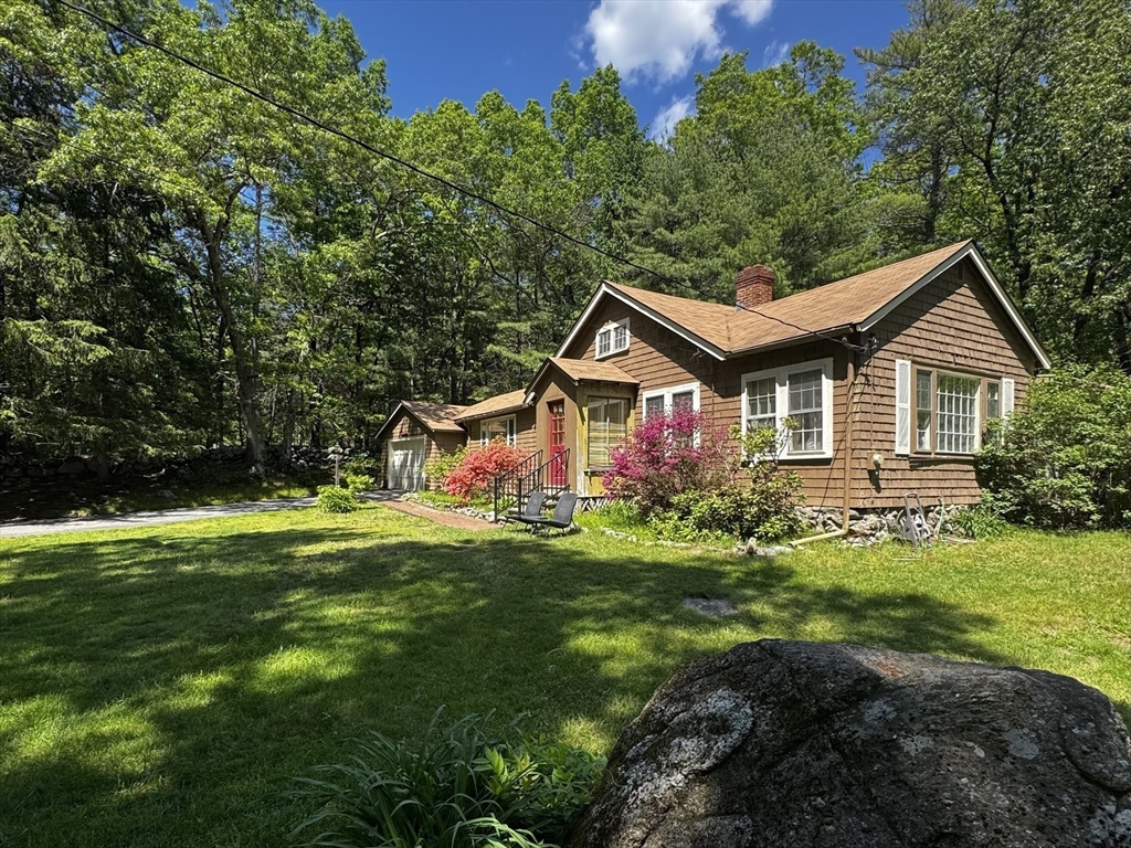 38 Rutland Street Carlisle, MA 01741 - Photo 5 of 18 a front view of a house with a garden