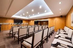 a view of a livingroom with furniture and a gym