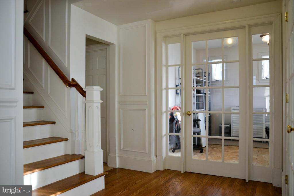 11613 Dewey Road Silver Spring, MD 20906 - Photo 3 of 15 a view of a hallway with wooden floor and entryway
