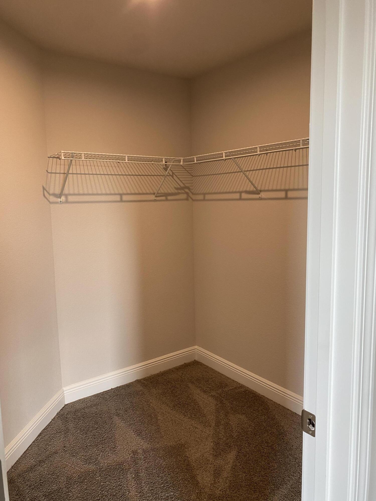 326 Keswick Lane Crestview, FL 32536 - Photo 15 of 22 a view of a room with racks on the wall