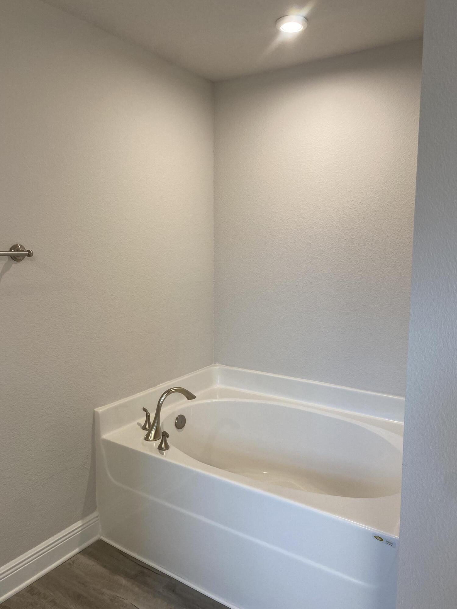 326 Keswick Lane Crestview, FL 32536 - Photo 17 of 22 a white bath tub sitting next to a white toilet