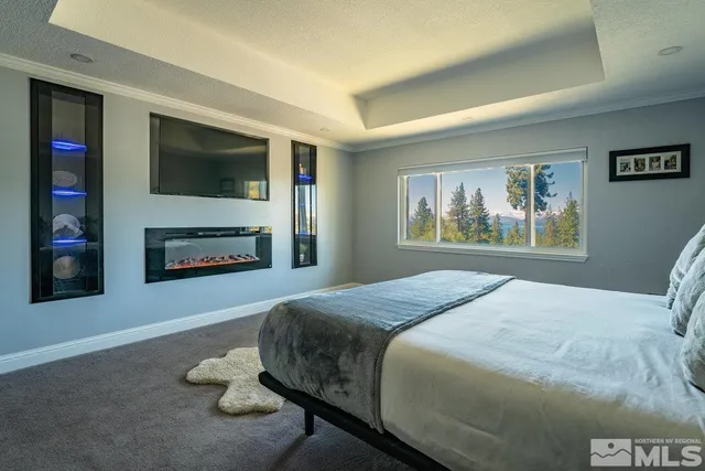 a bedroom with a bed and a fireplace