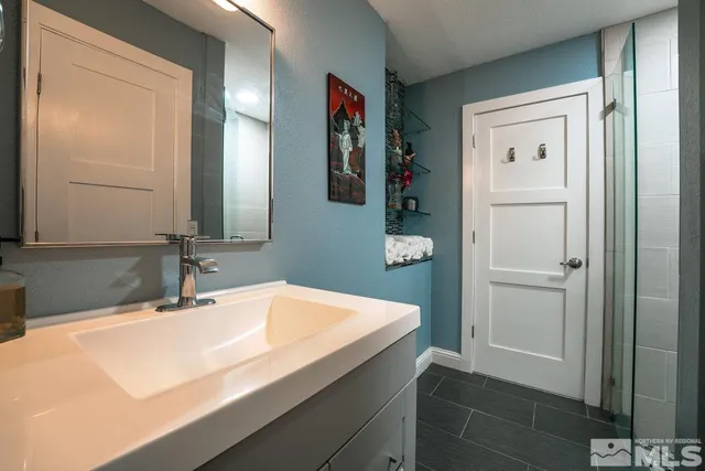 a bathroom with a sink and a mirror