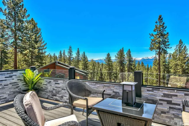 a view of a patio with couple of chairs