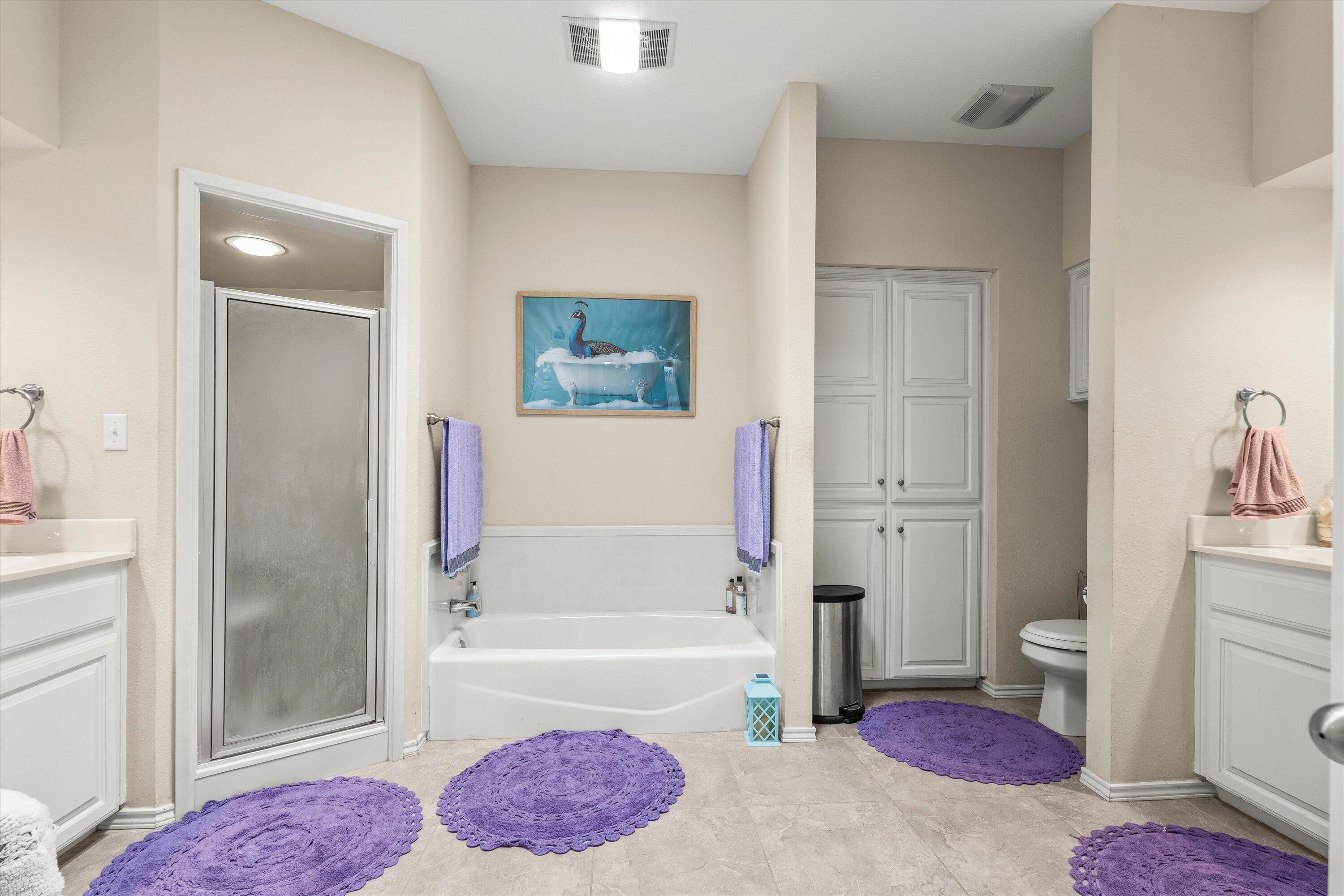 710 Poplar Street Levelland, TX 79336 - Photo 11 of 23 a bathroom with a tub shower sink and toilet