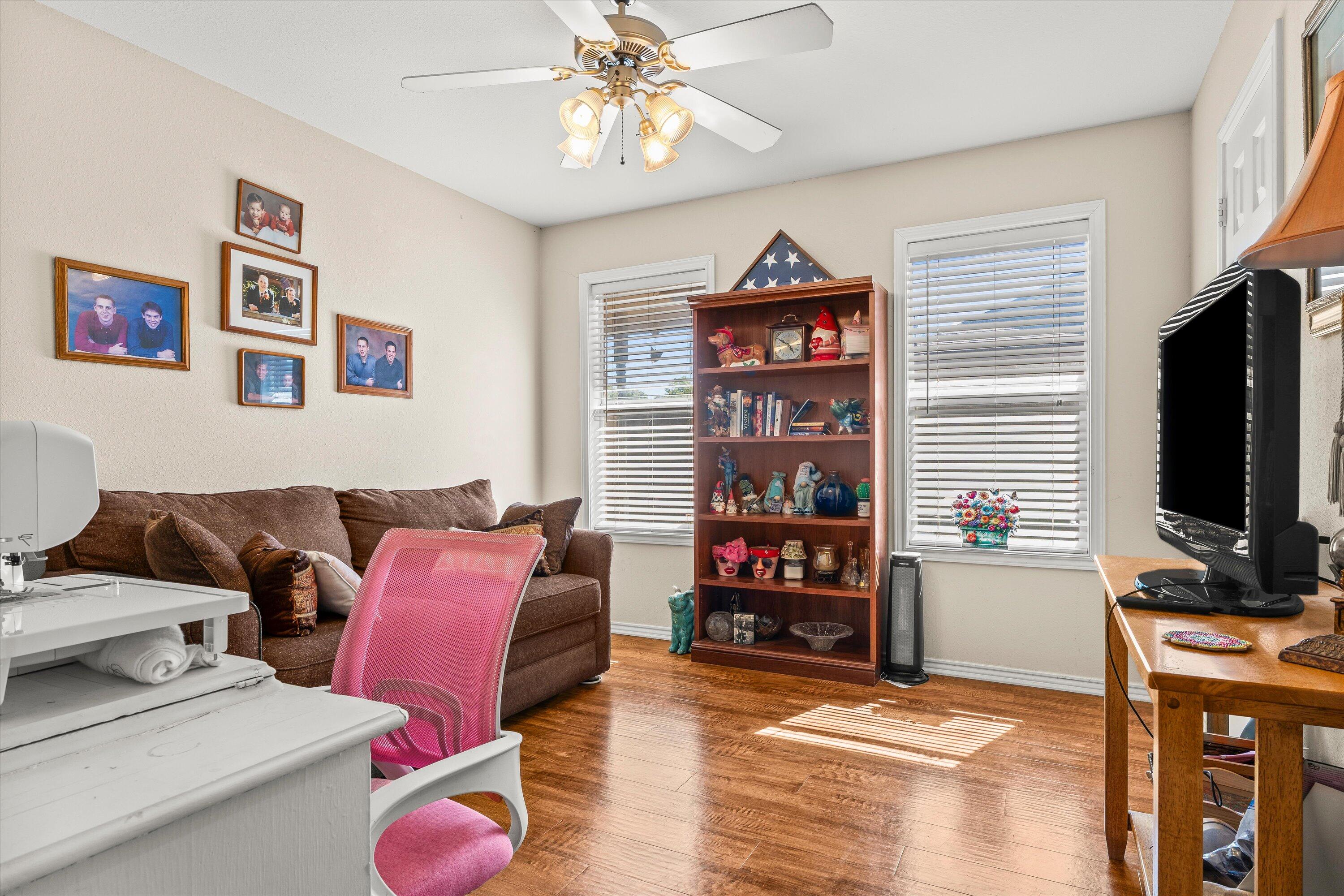 710 Poplar Street Levelland, TX 79336 - Photo 14 of 23 a living room with furniture and a flat screen tv